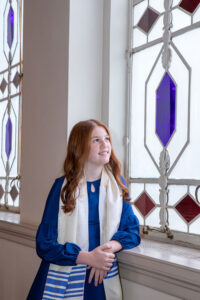 girl looking up at stained glass window