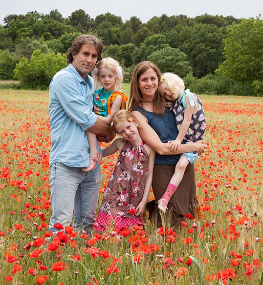 Family in field of flowers